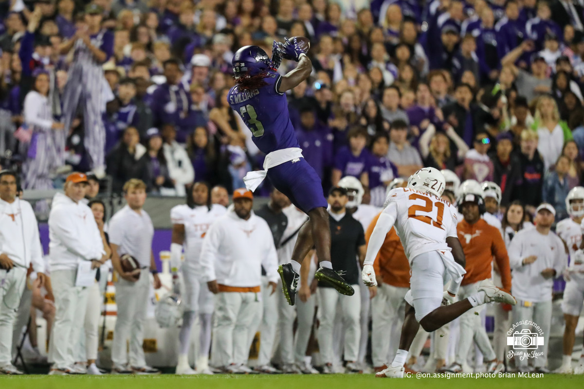 TCU WR Savion Williams goes high for the reception